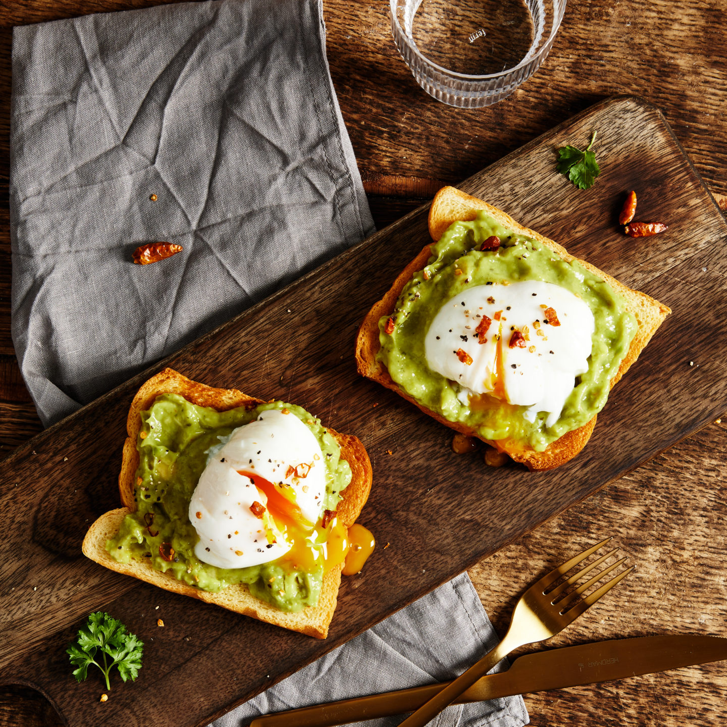Jan-YOU-ary with St Pierre. An overhead shot of brioche toast with avocado and poached eggs on top.