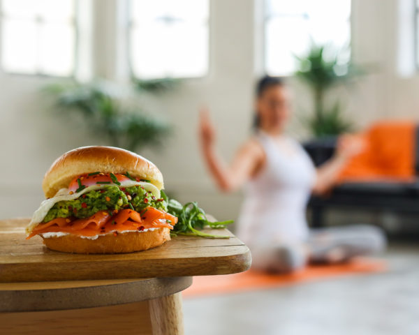 St Pierre Brioche Breakfast Burger With Woman Doing Yoga