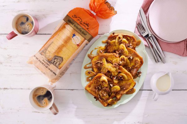 A French toast recipe on a table with brioche loaf