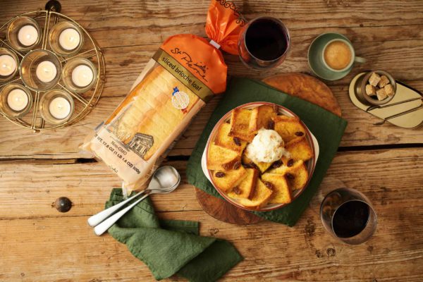 A table with a brioche dessert dish and brioche loaf